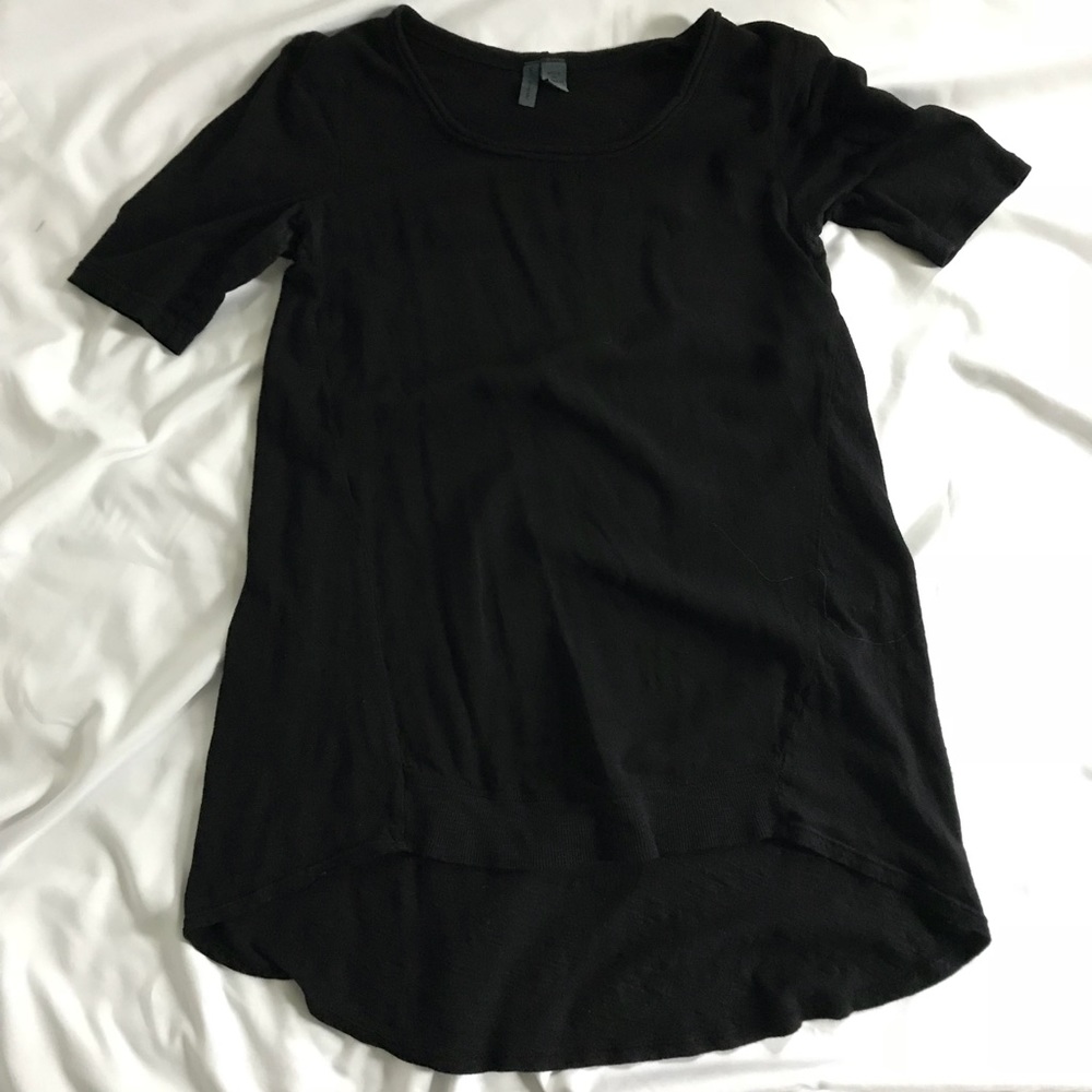 left of center | black tunic